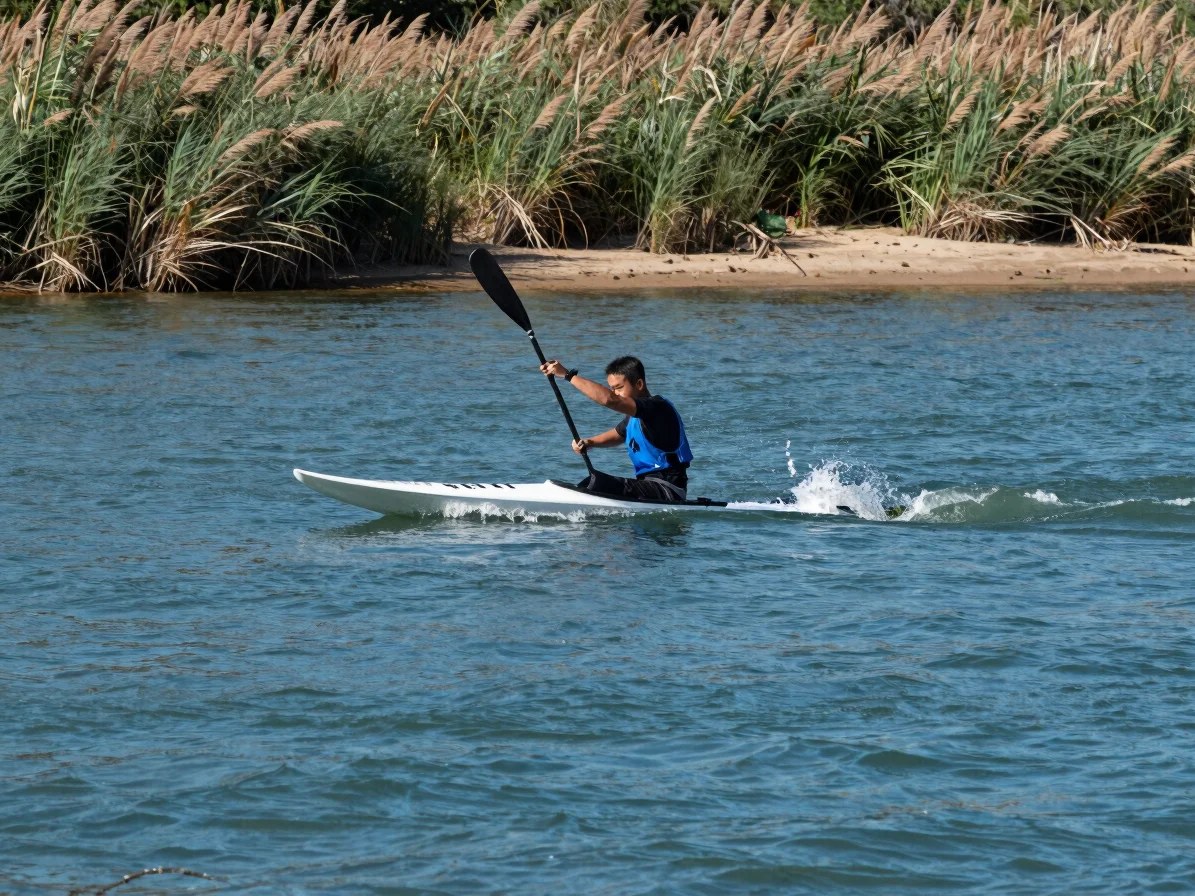 Paddler performing a sweep turn on a river, paddle arcing wide around the nose of the board, clear natural daylight, wid