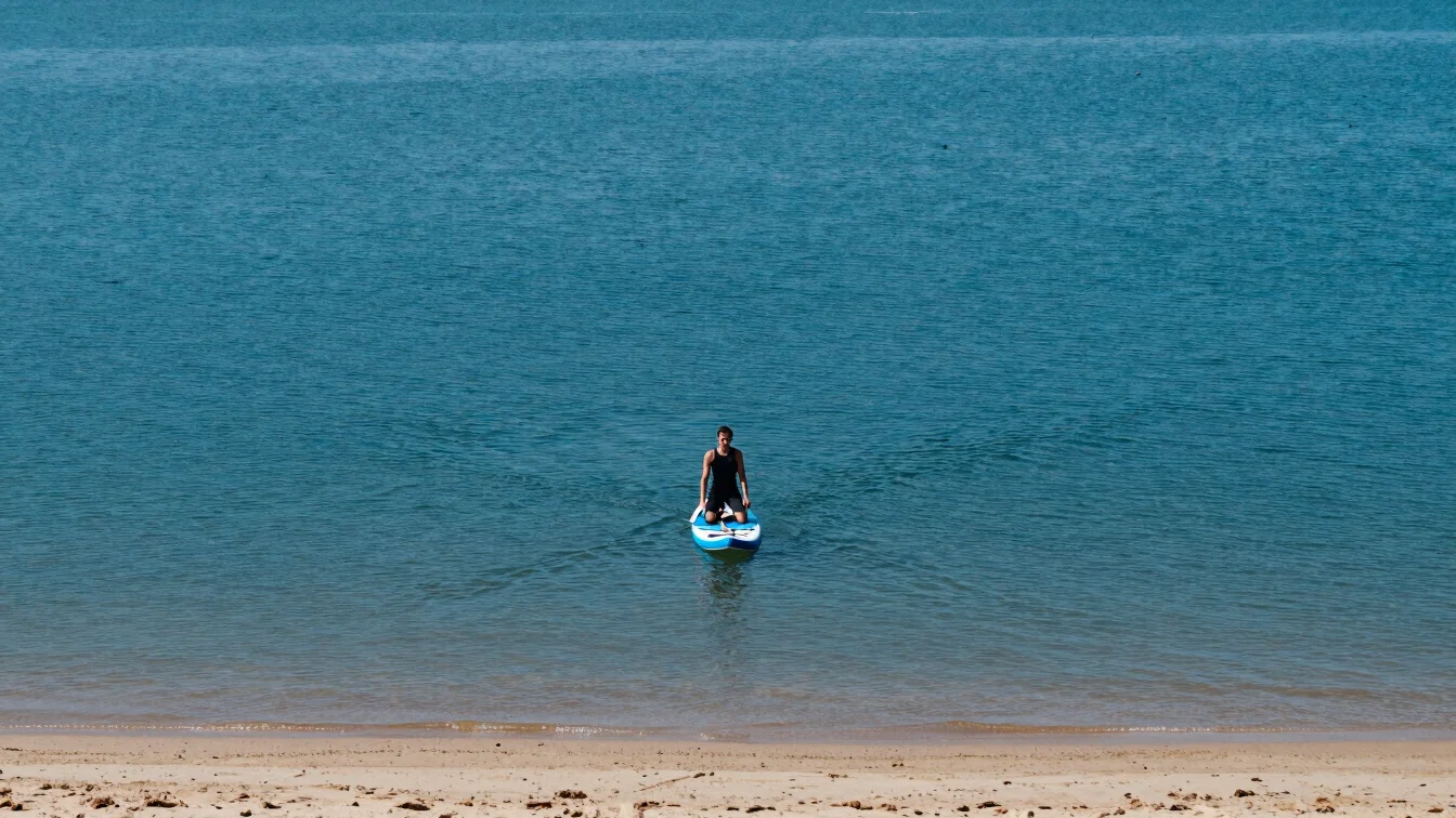 Close wide-angle view of a beginner kneeling centered on a stand